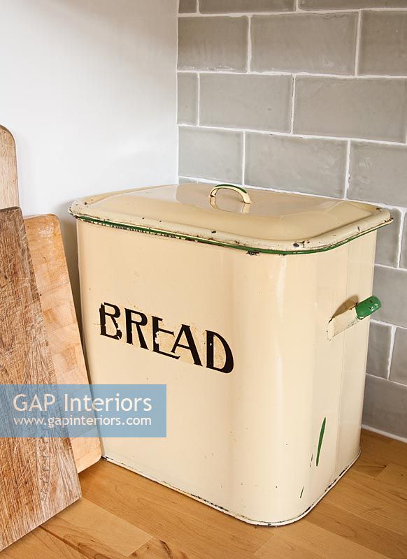 Vintage bread bin on kitchen worktop 