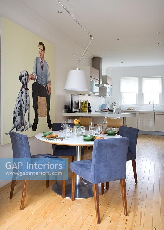 Large modern painting in dining room 