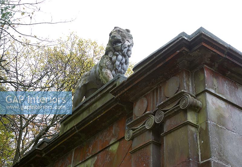 Lion statue on classic house exterior 
