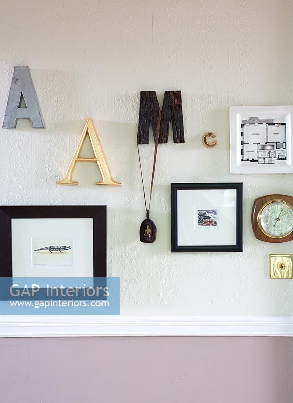 Display of pictures and letters on wall 
