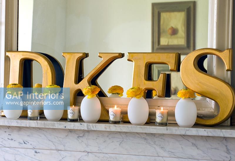 Detail of decorative letters and candles 