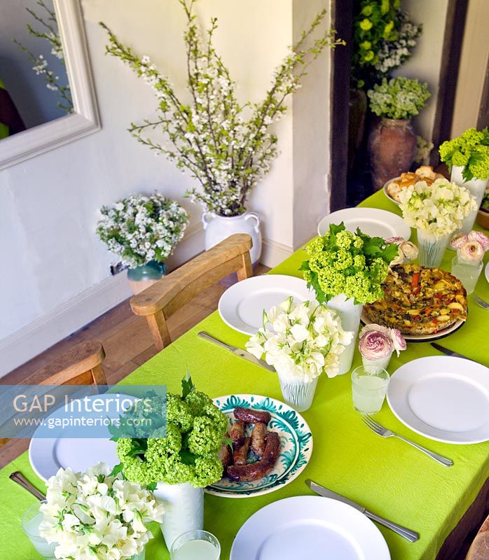 Dining table with flower displays 
