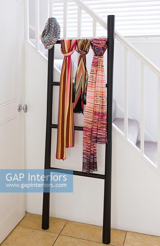 Missoni scarves displayed on ladder in hallway