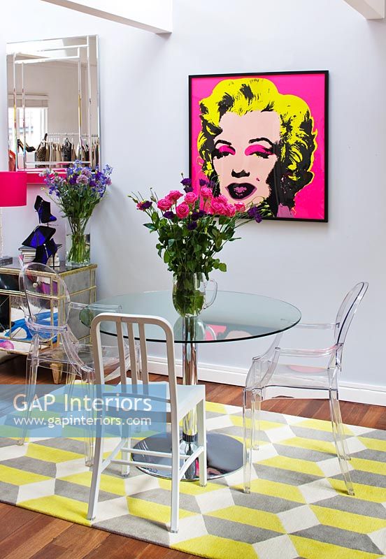 Open plan dining room with Warhol's Marilyn Monroe print