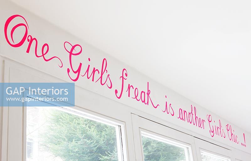 Pink lettering above window