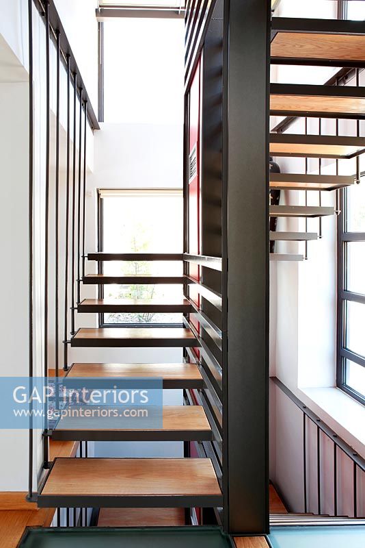 Modern metal staircase with wooden treads