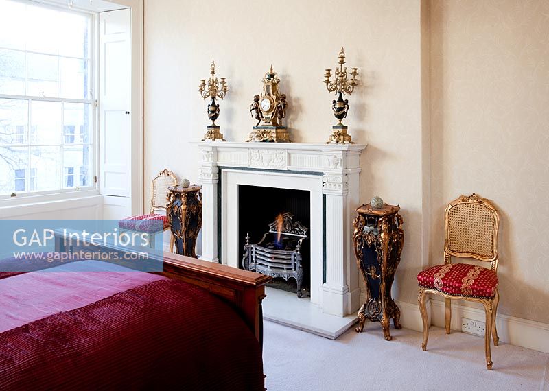 Fireplace in classic bedroom