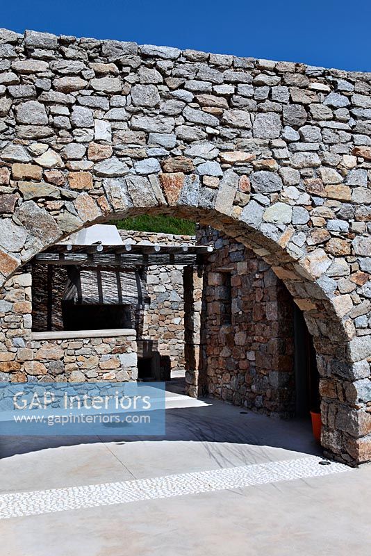 Greek villa with traditional arched wall 