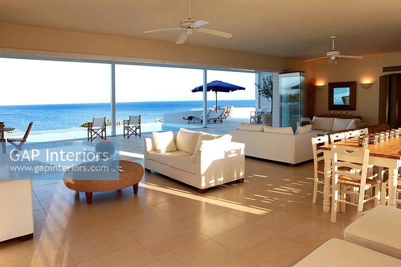 Modern white living room with sea view