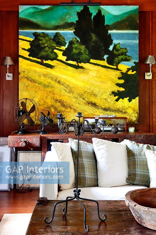 Painting of rural scene in living room