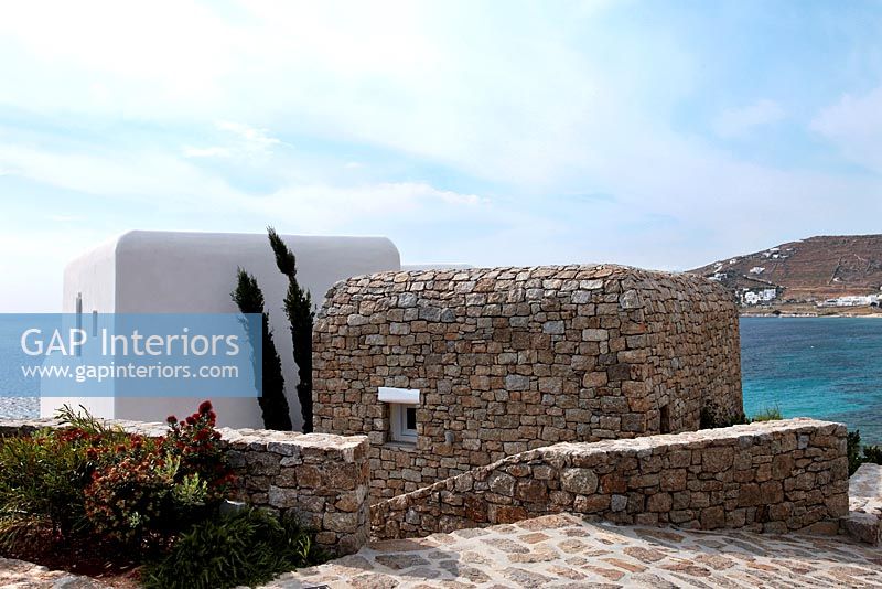 Exterior of Greek villa with sea view
