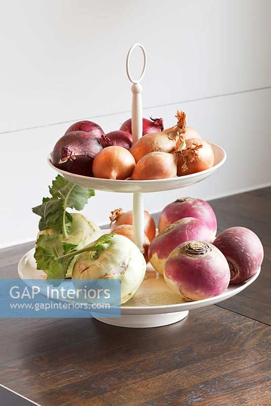 Root vegetables on cake stand