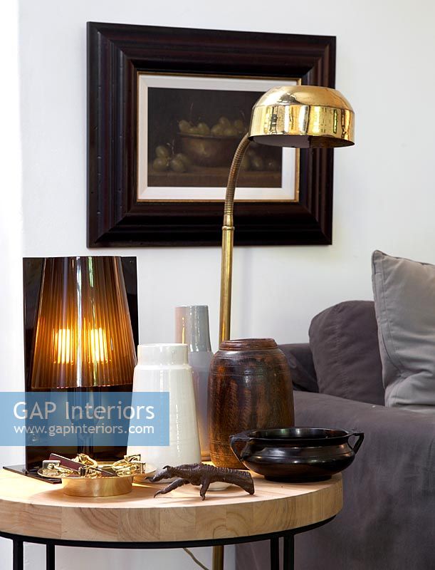 Vases and lamps on side table