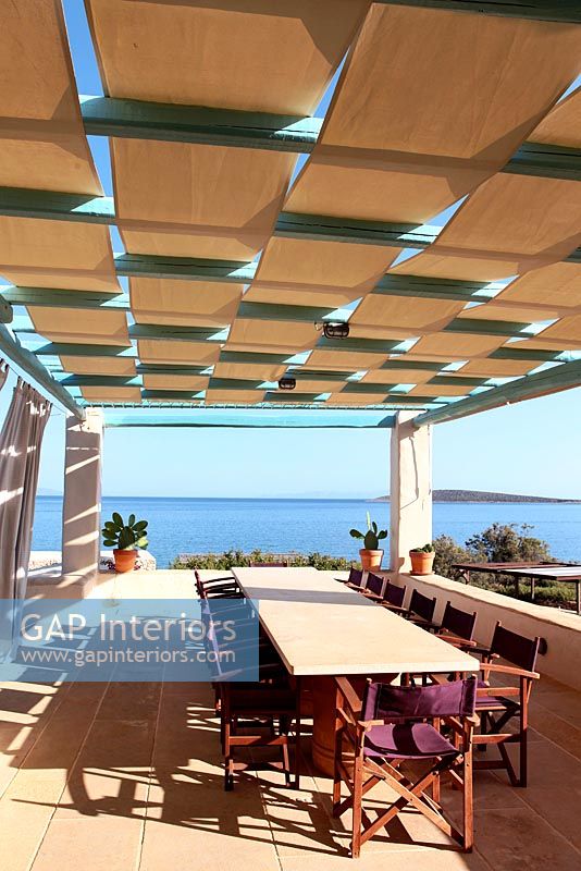 Dining area on patio with sea view