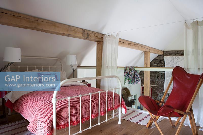 Country style bedroom on mezzanine level