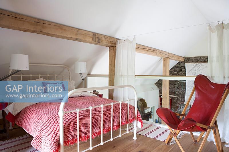 Country style bedroom on mezzanine level