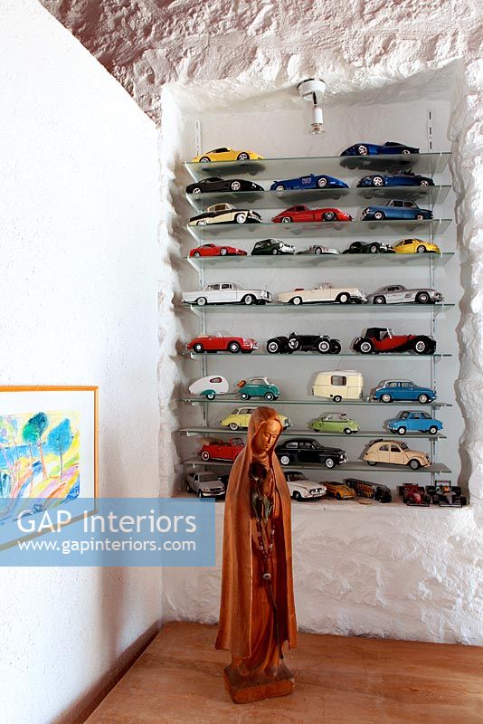Glass shelves with miniature cars