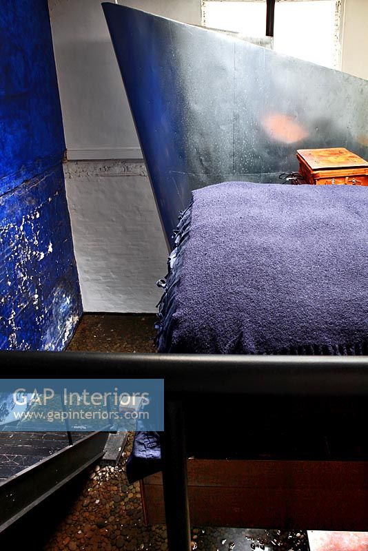 Industrial style blue bedroom
