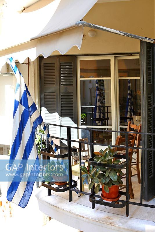 Traditional balcony with Greek flag