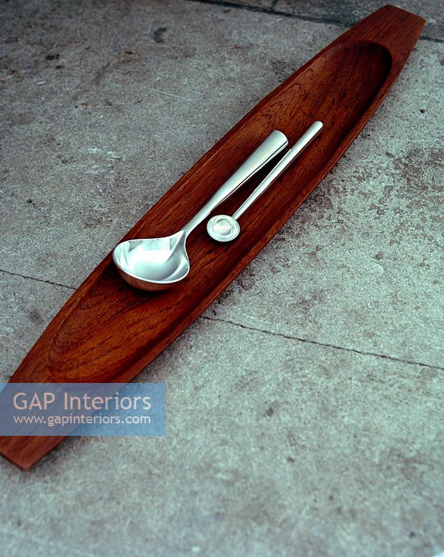 Cutlery on wooden platter