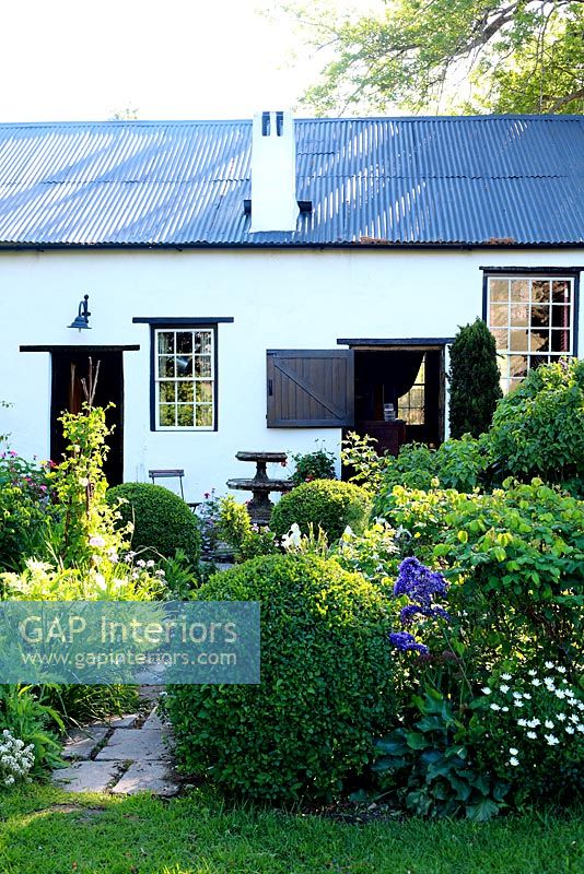 White cottage and garden