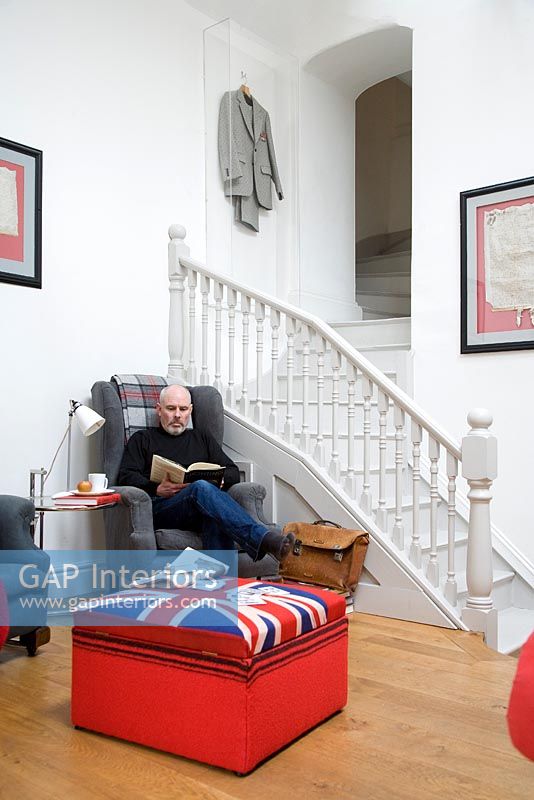 Nigel Stendgaard-Green relaxing in his living room