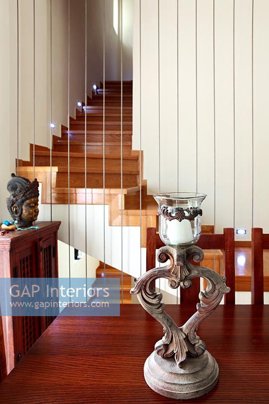 Modern staircase into dining room