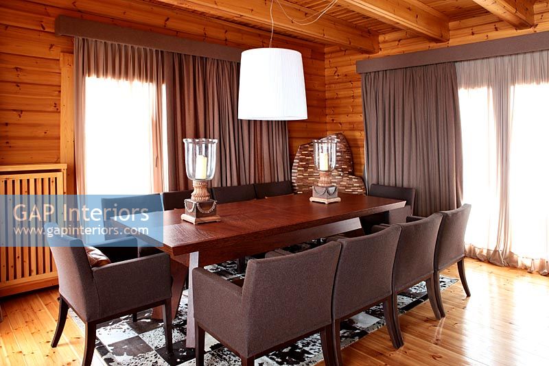 Modern dining room in traditional wooden house 