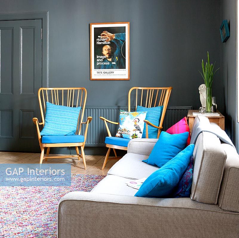 Grey living room with retro armchairs
