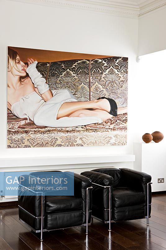 Contemporary art and leather armchairs