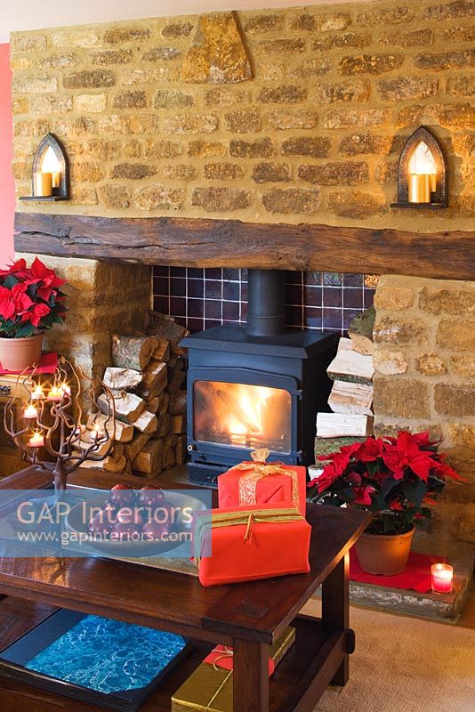 Country fireplace at Christmas with Poinsettias