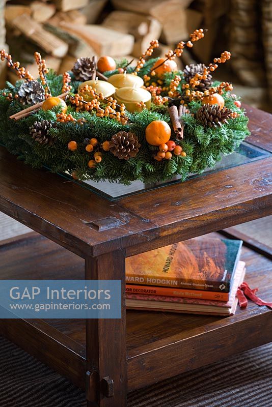 Christmas wreath on wooden coffee table