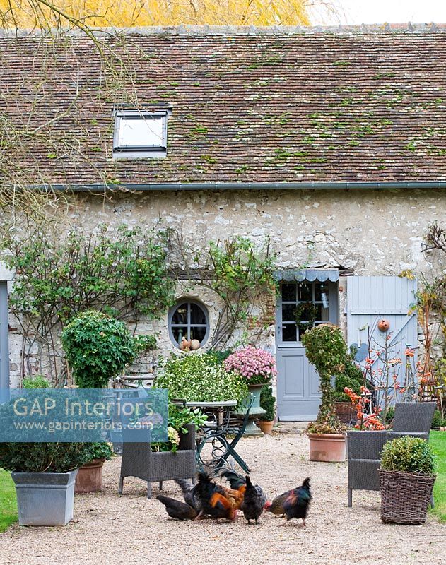 Traditional restored farmhouse with courtyard garden, France