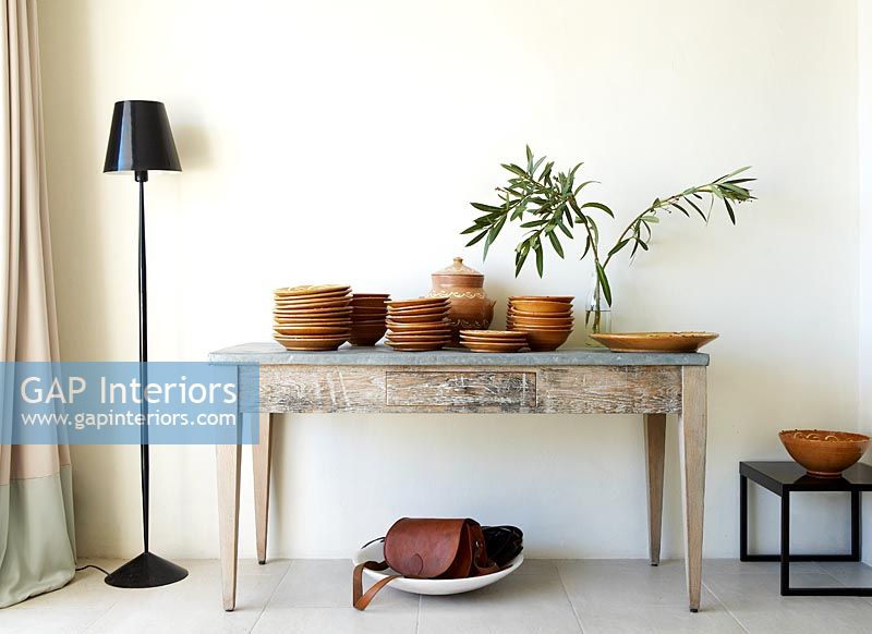 Earthenware pottery display on console table