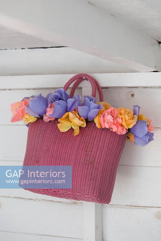 Flowers arranged in vintage bag