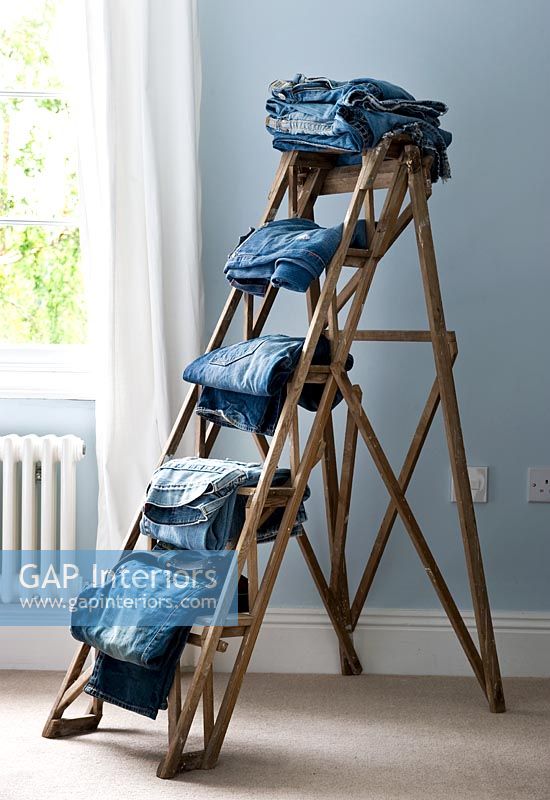 Jeans on wooden ladder
