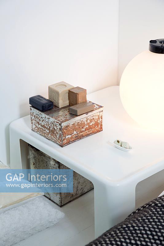 Modern side table and vintage boxes