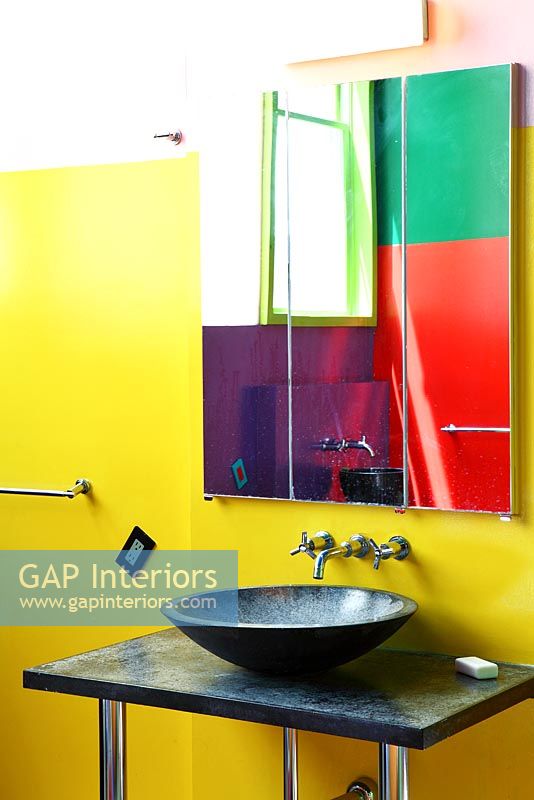 Colourful bathroom with stone sink
