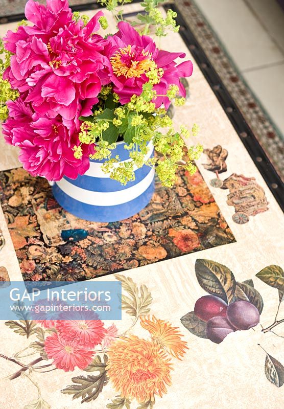 Flower arrangement on patterned coffee table