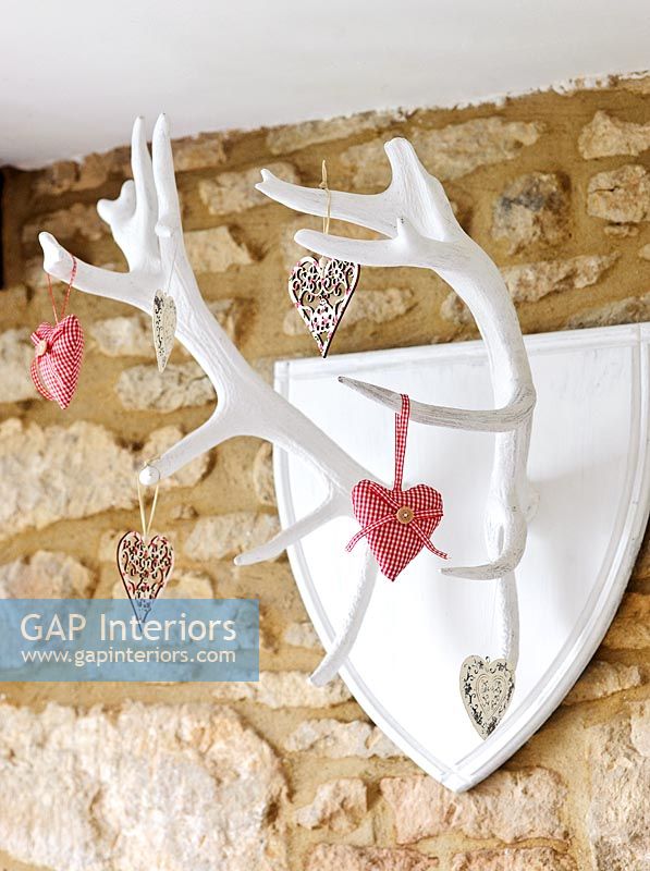 Heart decorations hanging from antlers