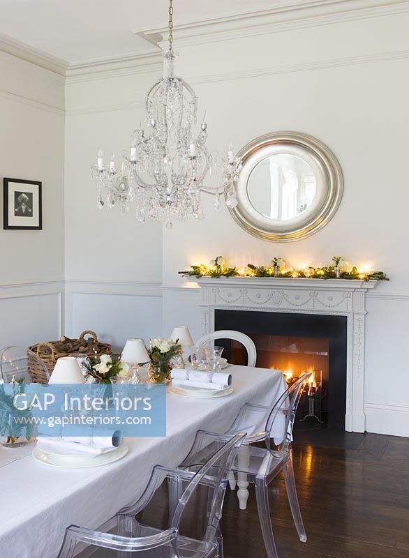White dining room decorated for christmas