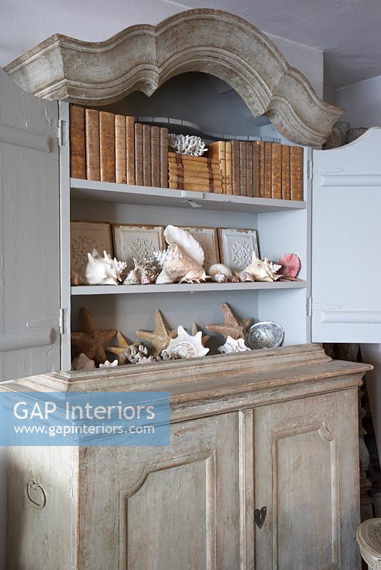 Ornate dresser with display of sea shells