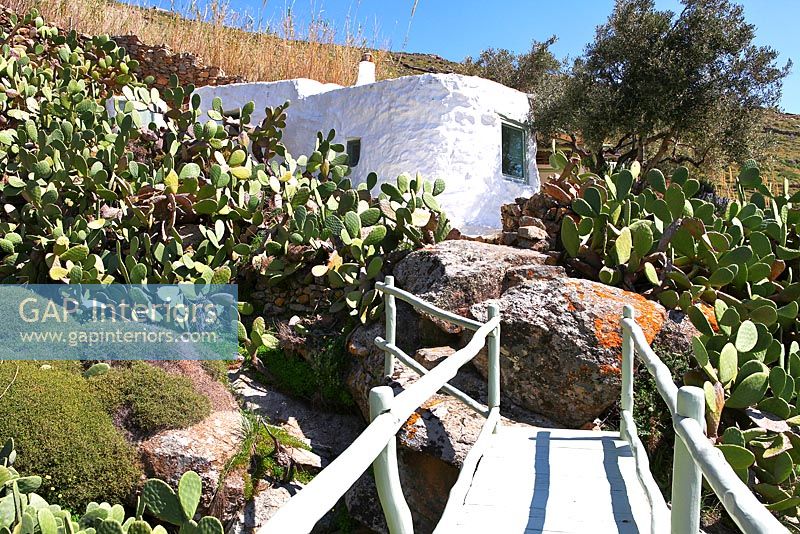 Traditional greek villa and rock garden