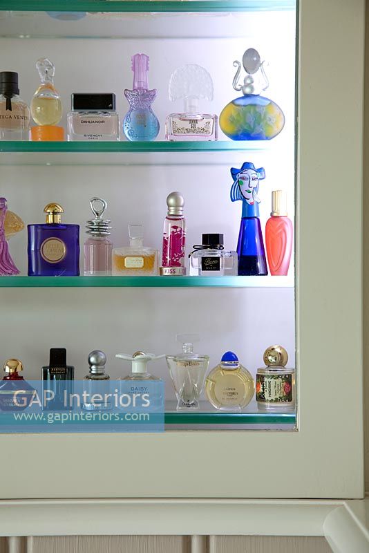 Perfume bottles in display cabinet
