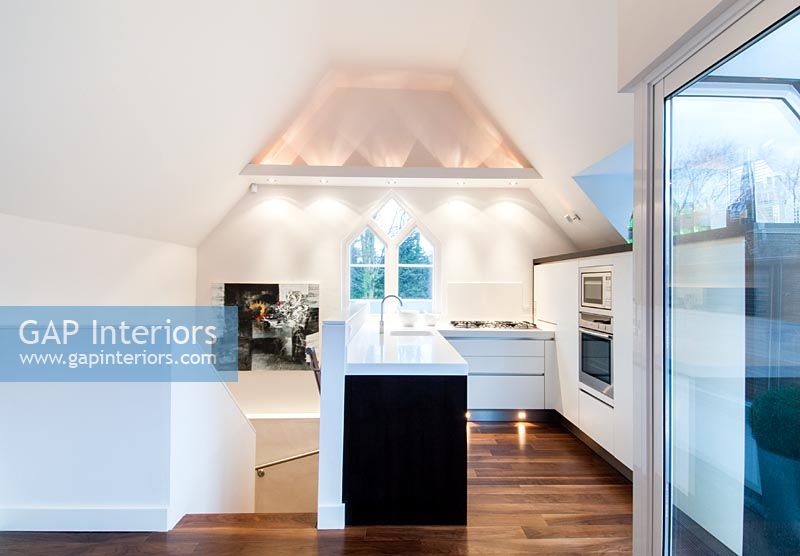 Contemporary kitchen in converted chapel