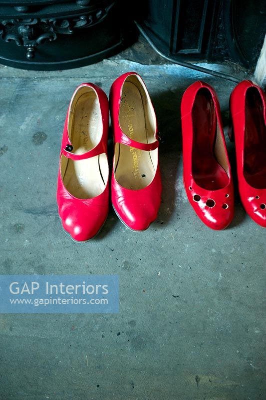 Red shoes on hearth