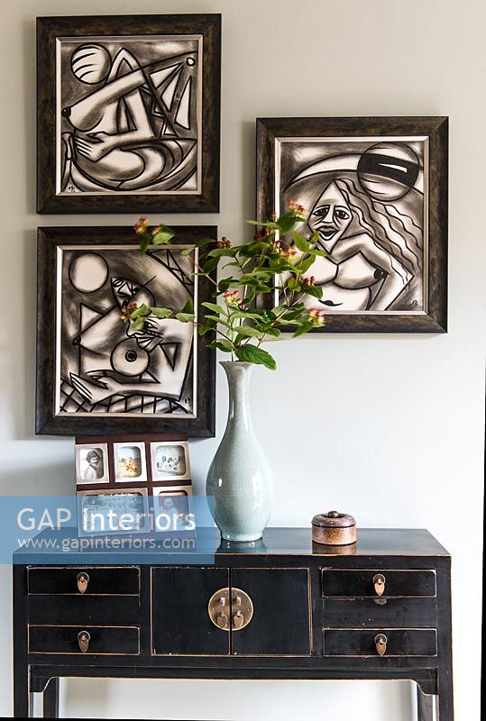 Modern art above oriental style console table