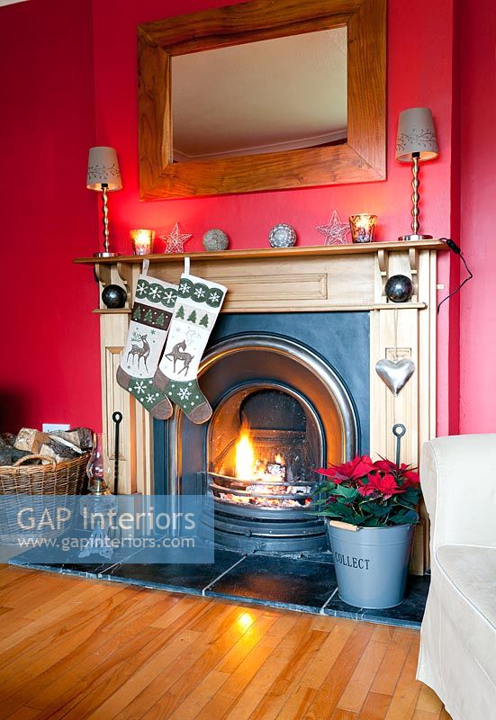 Christmas stockings hanging by fire