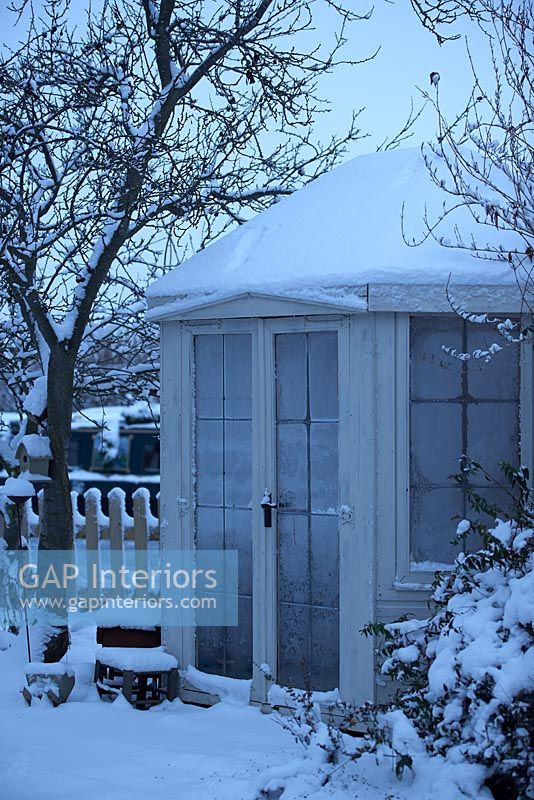 Summerhouse covered in snow