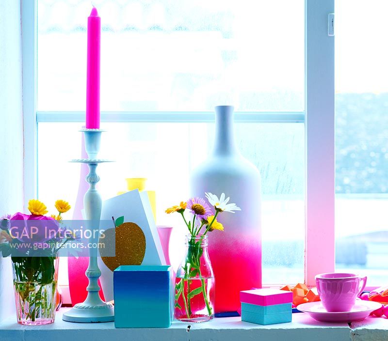 Colourful objects on windowsill
